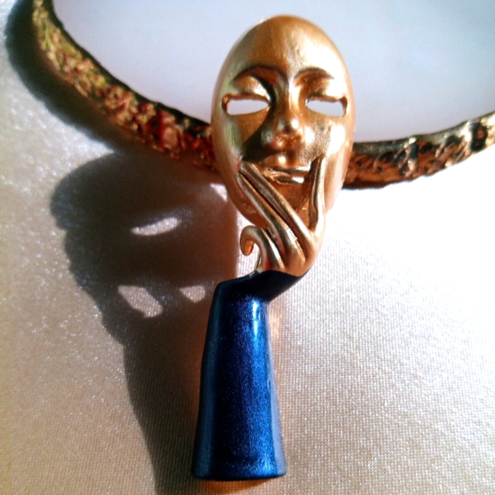 Hand holding a mask Brooch